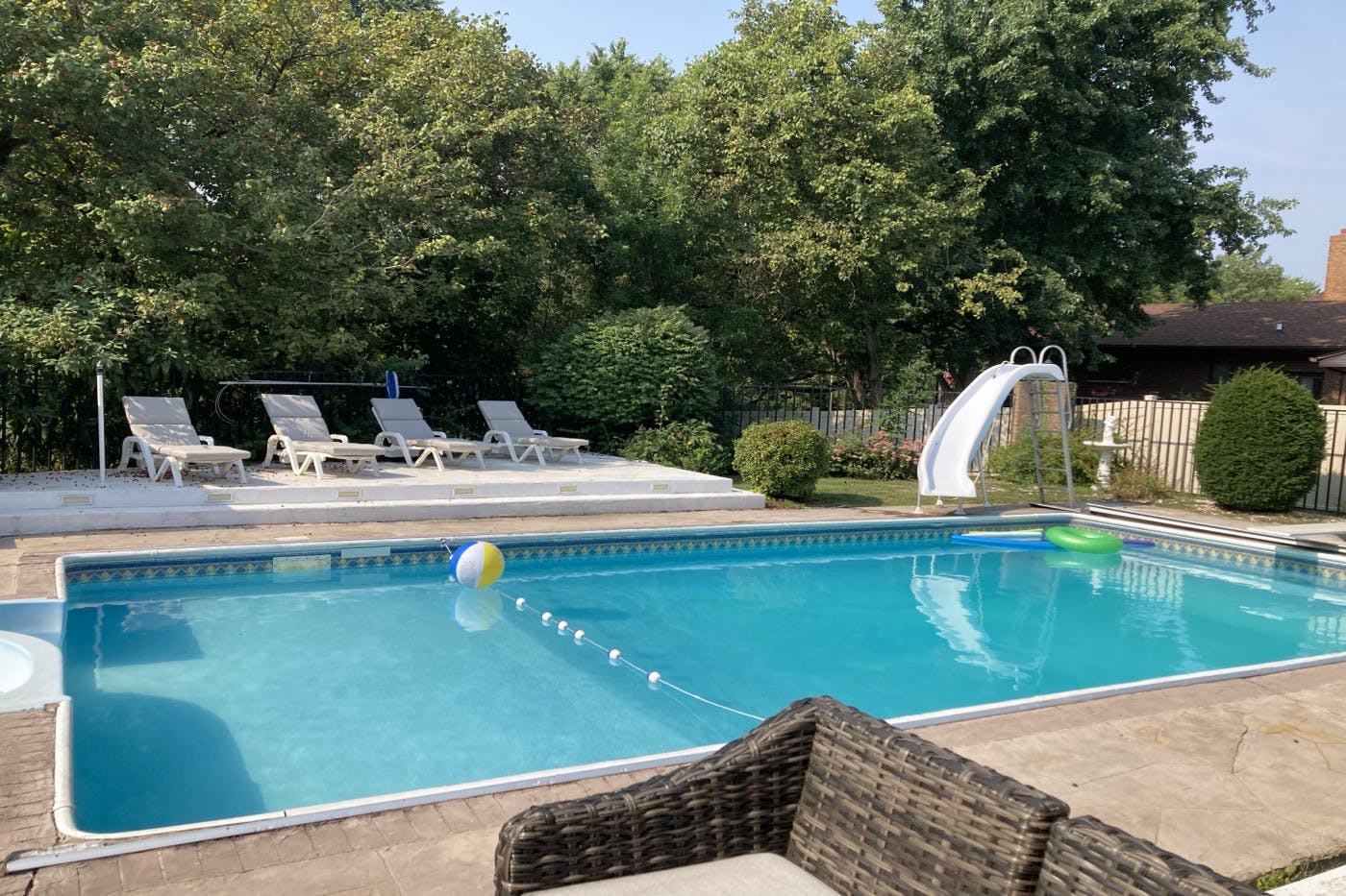 Swimming pool - heated/night lights/water fall/cobbleston deck/bench/tables /lawn chairs
